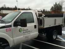 Driver's side photo of a white pick up truck with the Waste Authority logo on the door