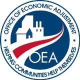 Blue and red logo of the Office of Economic Adjustment OEA, a red road with blue and white building on the left and "OEA" on the right "Helping Communities Help Themselves" is below the logo