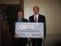 Dennis Yablonksy, Secretary of the Department of Community and Economic Development, presents the $158,500 grant check to Chuck Leonard, Executive Director of Pocono Mountains Economic Development Corporation at the PA Brownfields Conference in Harrisburg