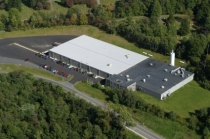 Aerial view of industrial building and parking lot