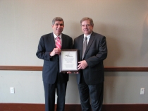 PMEDC Executive Director and outgoing Penn’s Northeast Chairman is honored by incoming Board Chairman, John Cognetti with an award