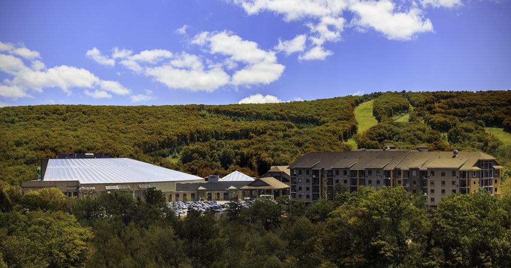 CBK Lodge facilities with mountains surrounding